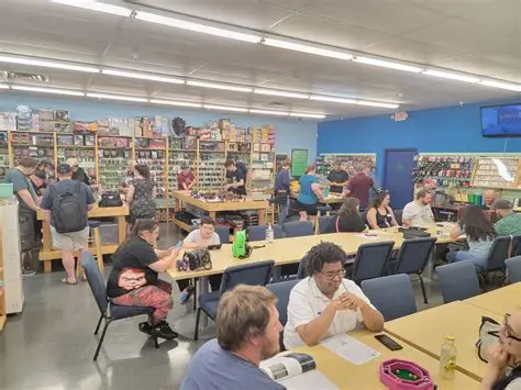 Players seated at the tables during game day at Geek World, Tyler, TX
