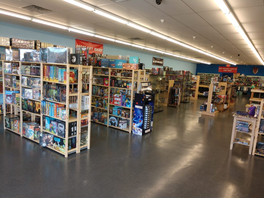 Board game aisle inside Geek World, Tyler, TX, with fully stocked shelves