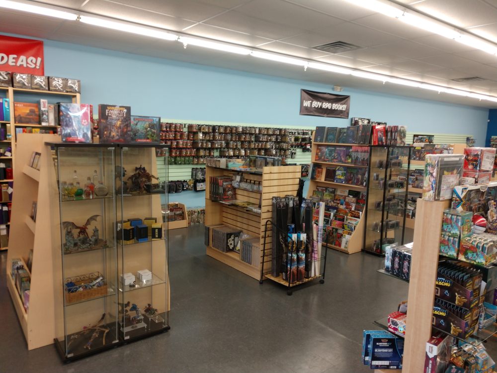 Miniatures, RPG books and display cases inside Geek World, Tyler, TX